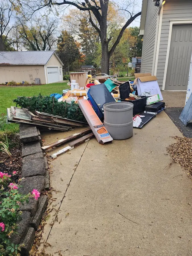 Dumpster being loaded with debris for Estate Cleanout Dumpster Rental in Westview